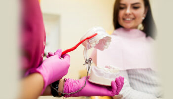 How do you clean and maintain All-on-4 denture implants daily?